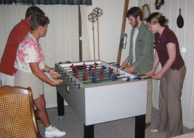 Clada, Kevin, Em and Ken Playing Foosball